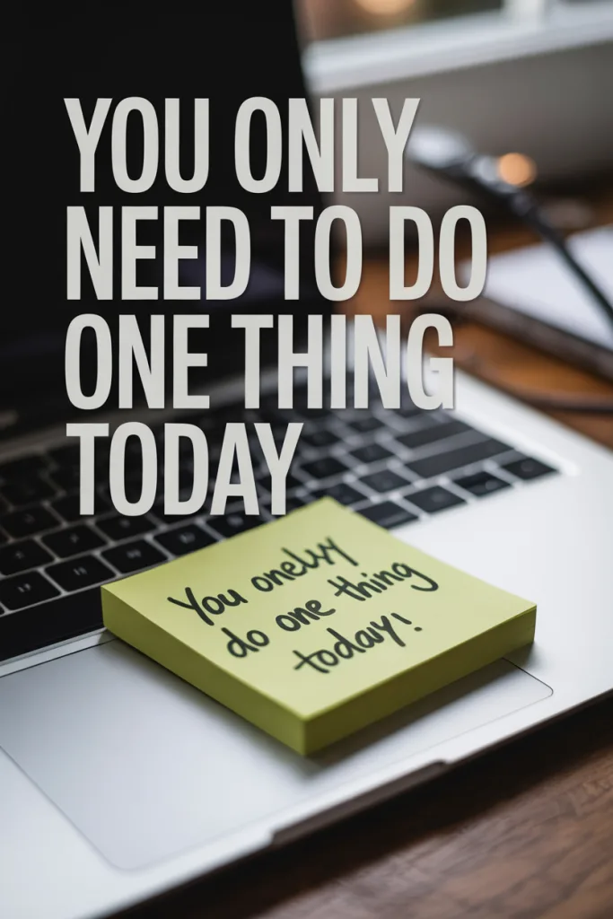  A single sticky note on a desk with the words “just one thing” written on it