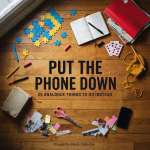 Colourful collection of analogue activities, including journaling, reading, crochet, puzzles and collage, with a phone placed face-down.